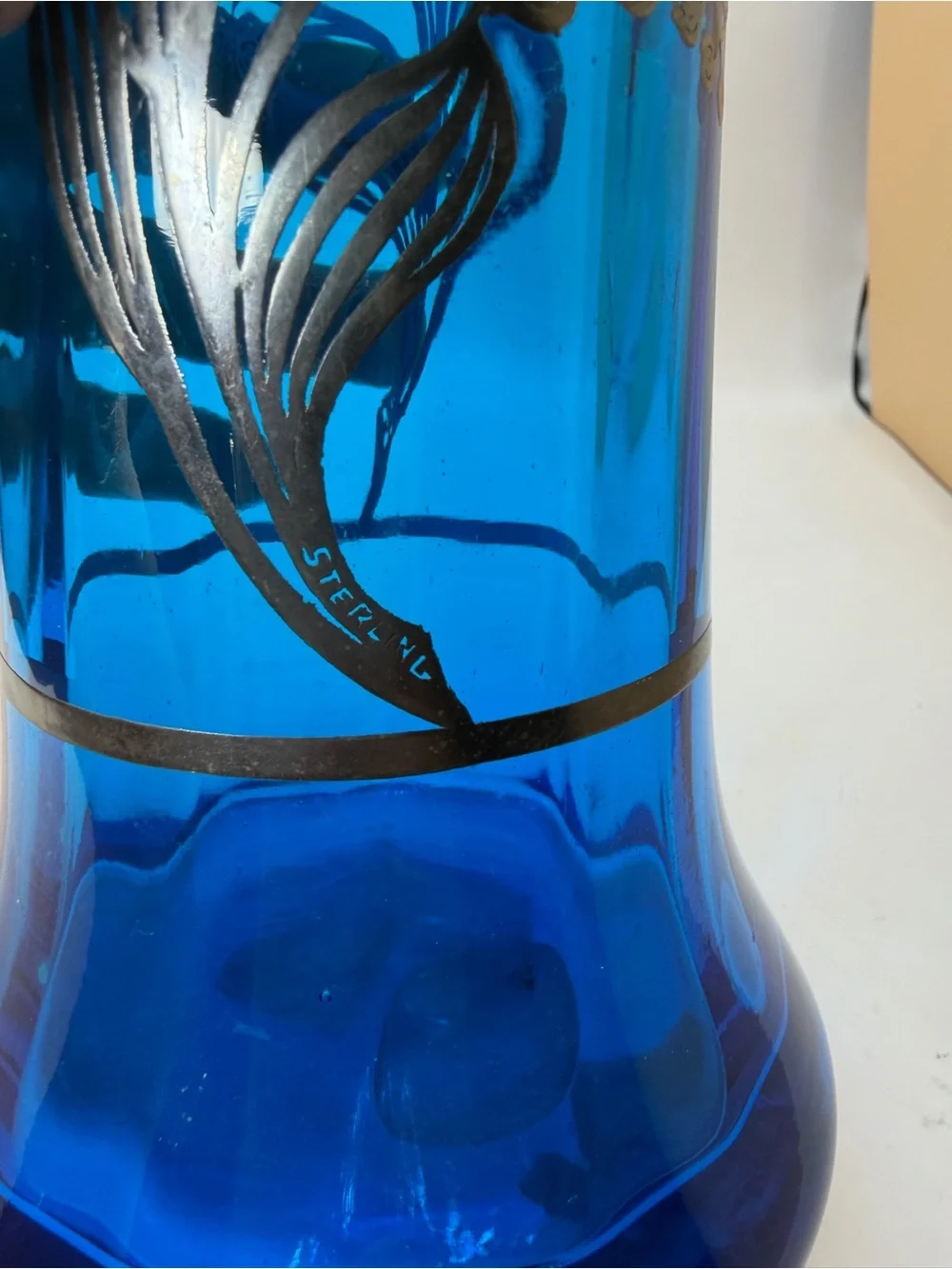 Blue Glass Ruffled Edge Decorative Vase with Sterling Silver Floral Overlay.